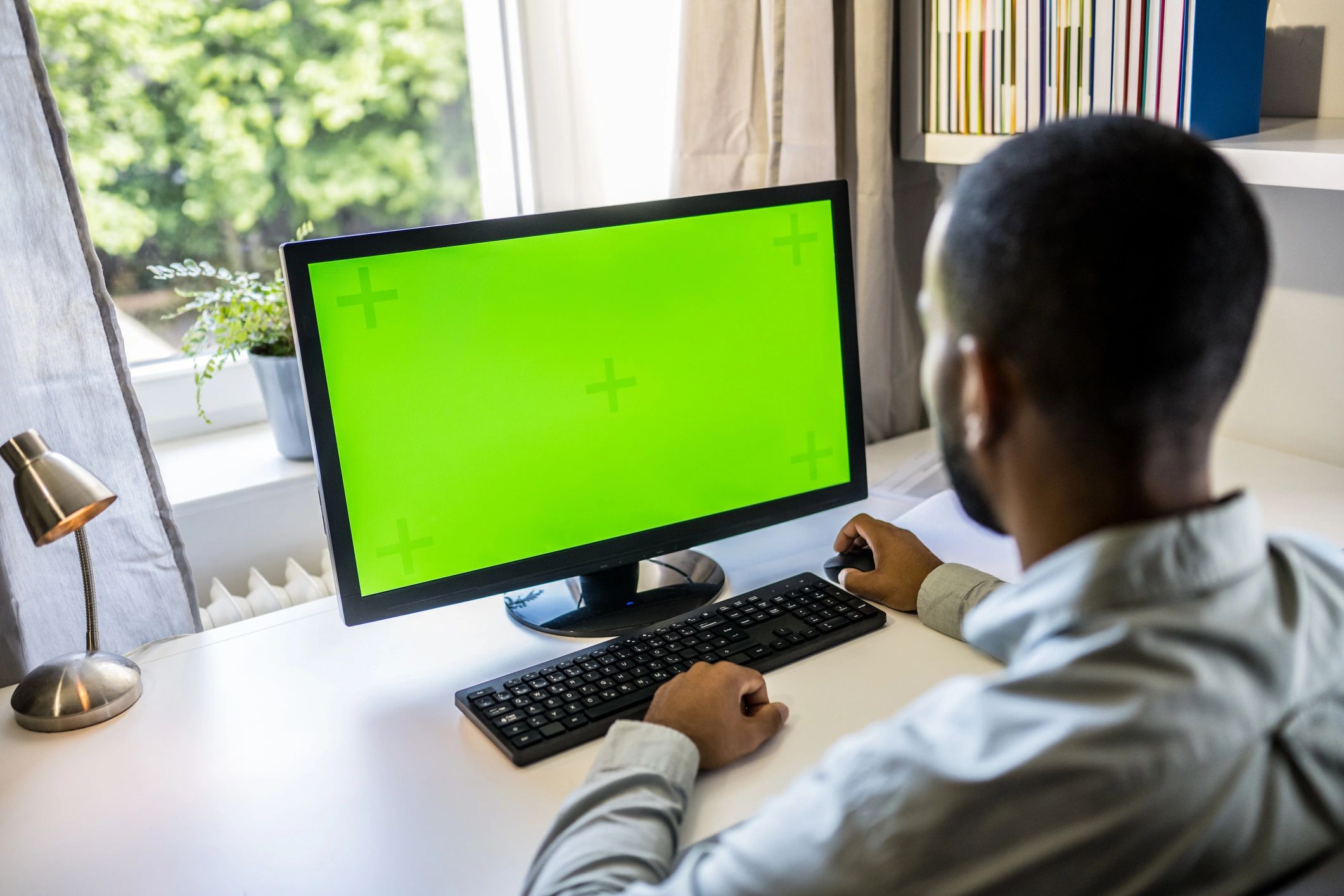 Cybersecurity professional working at a computer workstation
